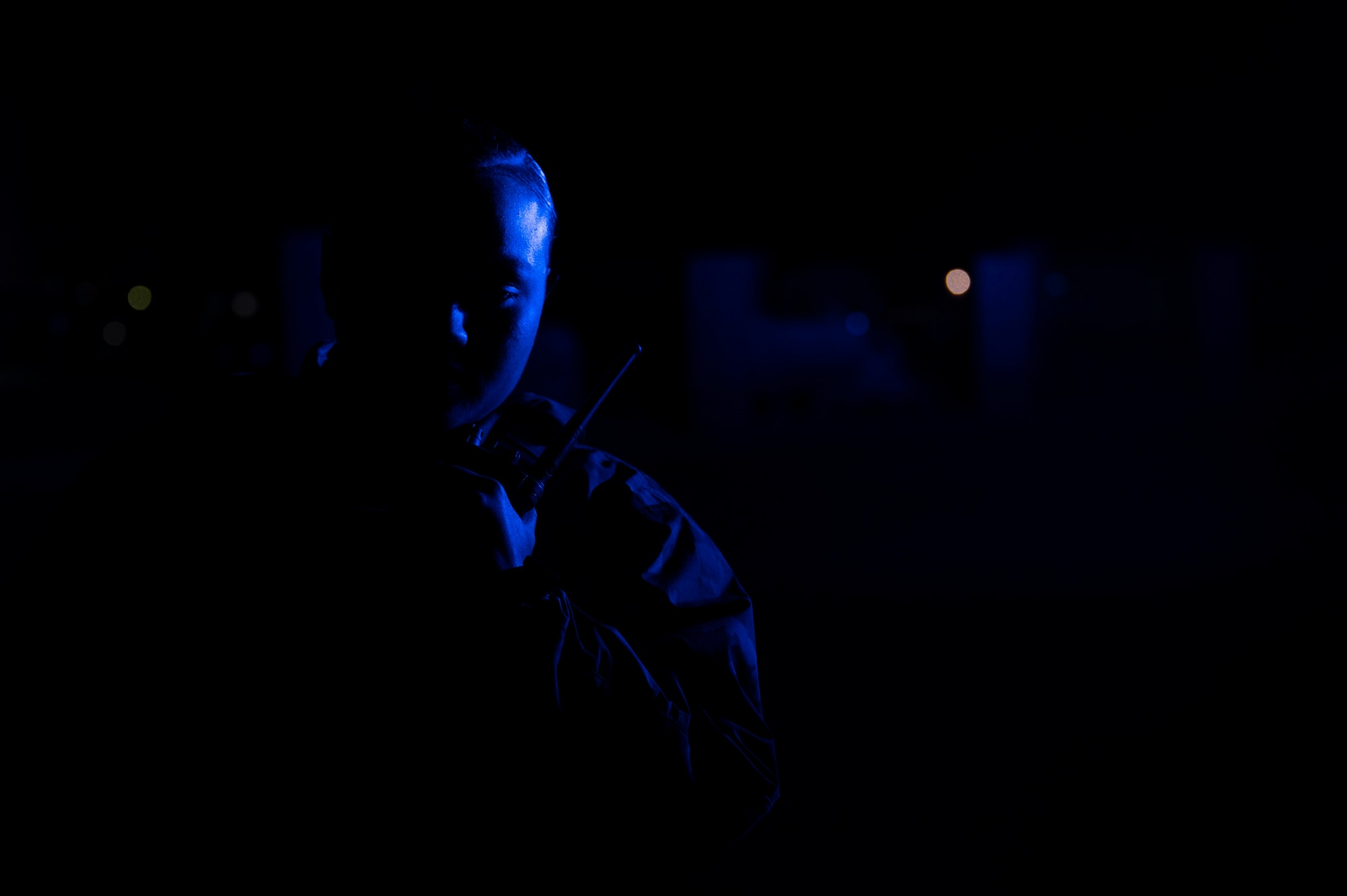 Security Forces member holding a radio