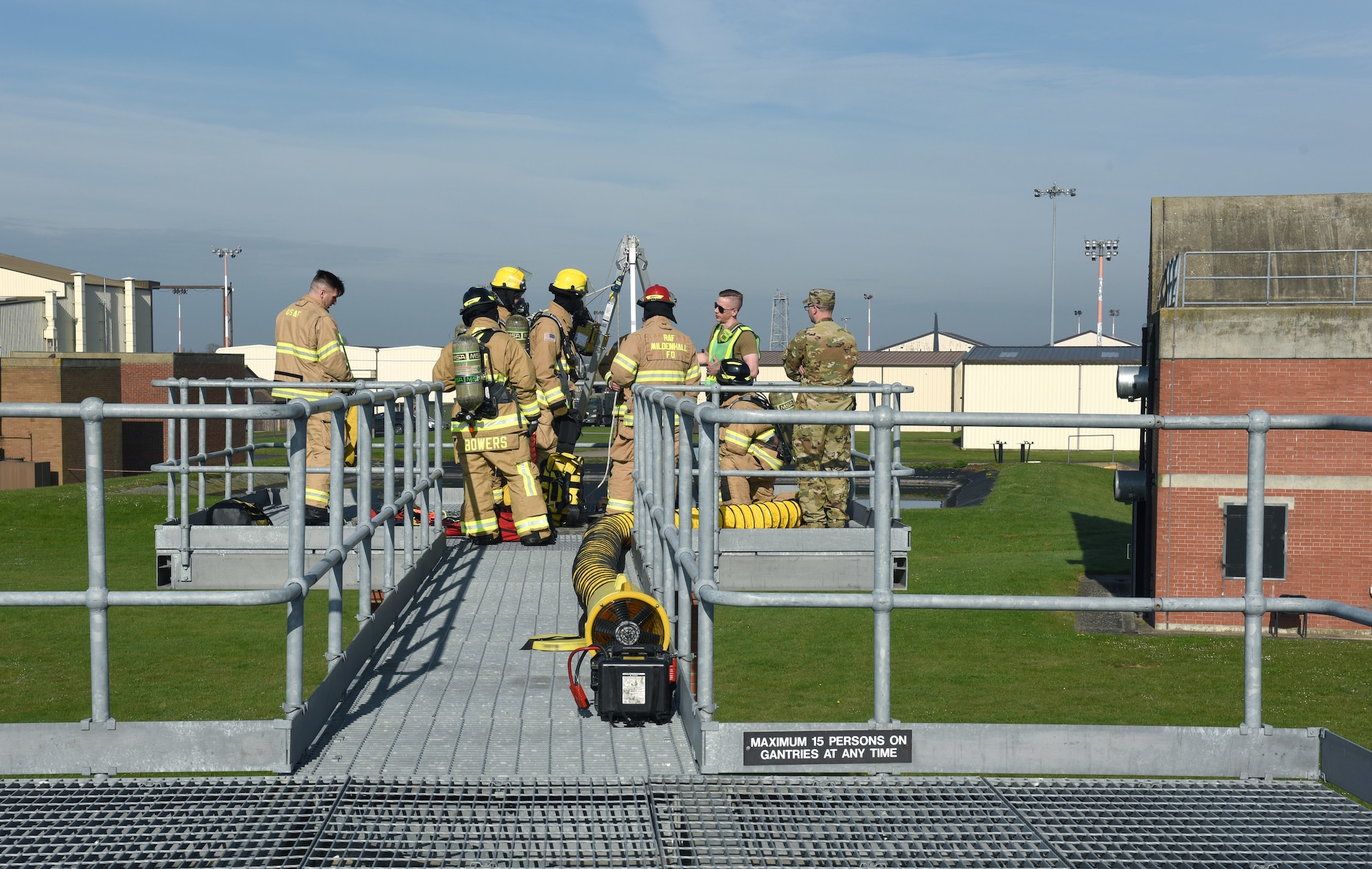 U.S. Air Force and British civilian firefighters, assigned to the 100th Civil Engineer Squadron Fire Department, carry out confined space training at the purpose-built facility on Royal Air Force Mildenhall, England, April 14, 2022. The fire department conducts a full confined-space drill at least four times a year for firefighters to meet training requirements. It’s vital for them to stay proficient with confined space and rescue to ensure they can successfully respond to real-world emergencies. (U.S. Air Force photo by Karen Abeyasekere)