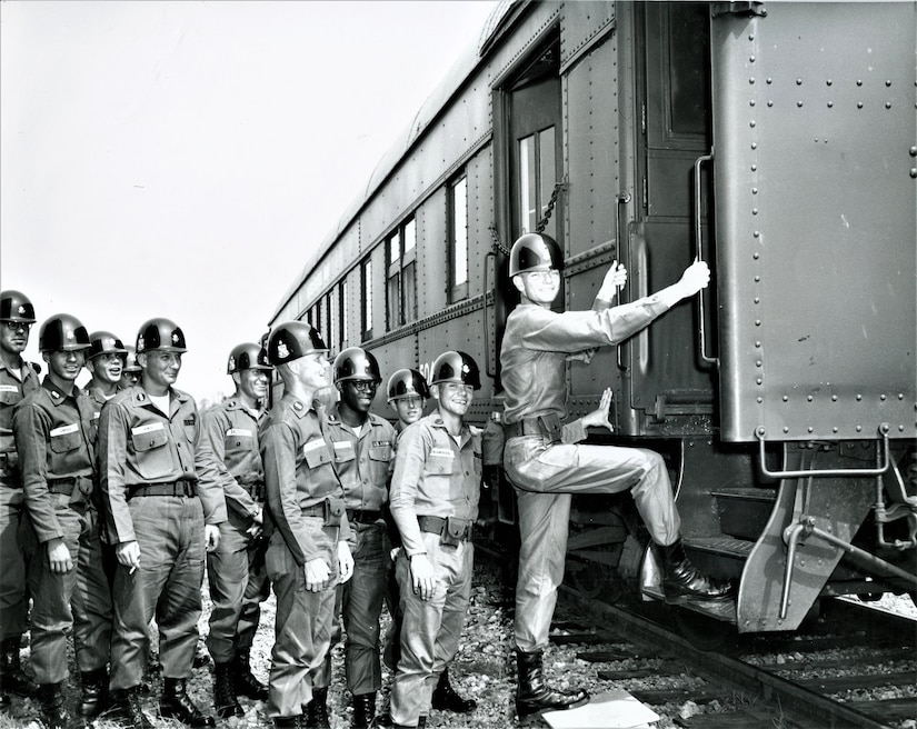 Soldiers board a train.