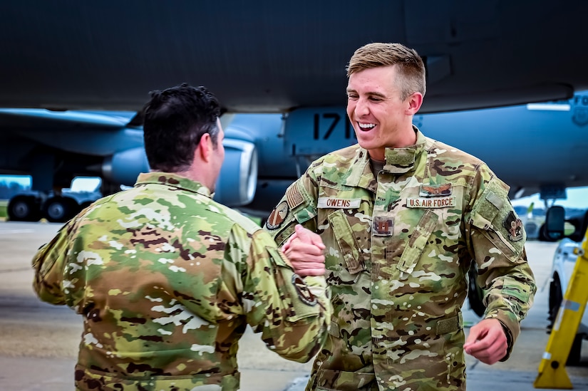 U.S. Air Force Lt. Col. Derek Rankin (Left), 32nd Air Refueling Squadron, commander and Capt. Gavin Owens (Right), 32nd Air Refueling Squadron, pilot, celebrate the return of the last KC-10 Extender from Central Command at Joint Base McGuire-Dix-Lakehurst, New Jersey, Apr. 19, 2022. The return marks an end to over thirty years of air refueling support provided to the U.S. and coalition partners through both peace and war, beginning with Operation Desert Shield/Desert Storm in 1990-91, through the conflicts in Iraq and Afghanistan, and punctuated by Operation Allies Refuge in 2021.