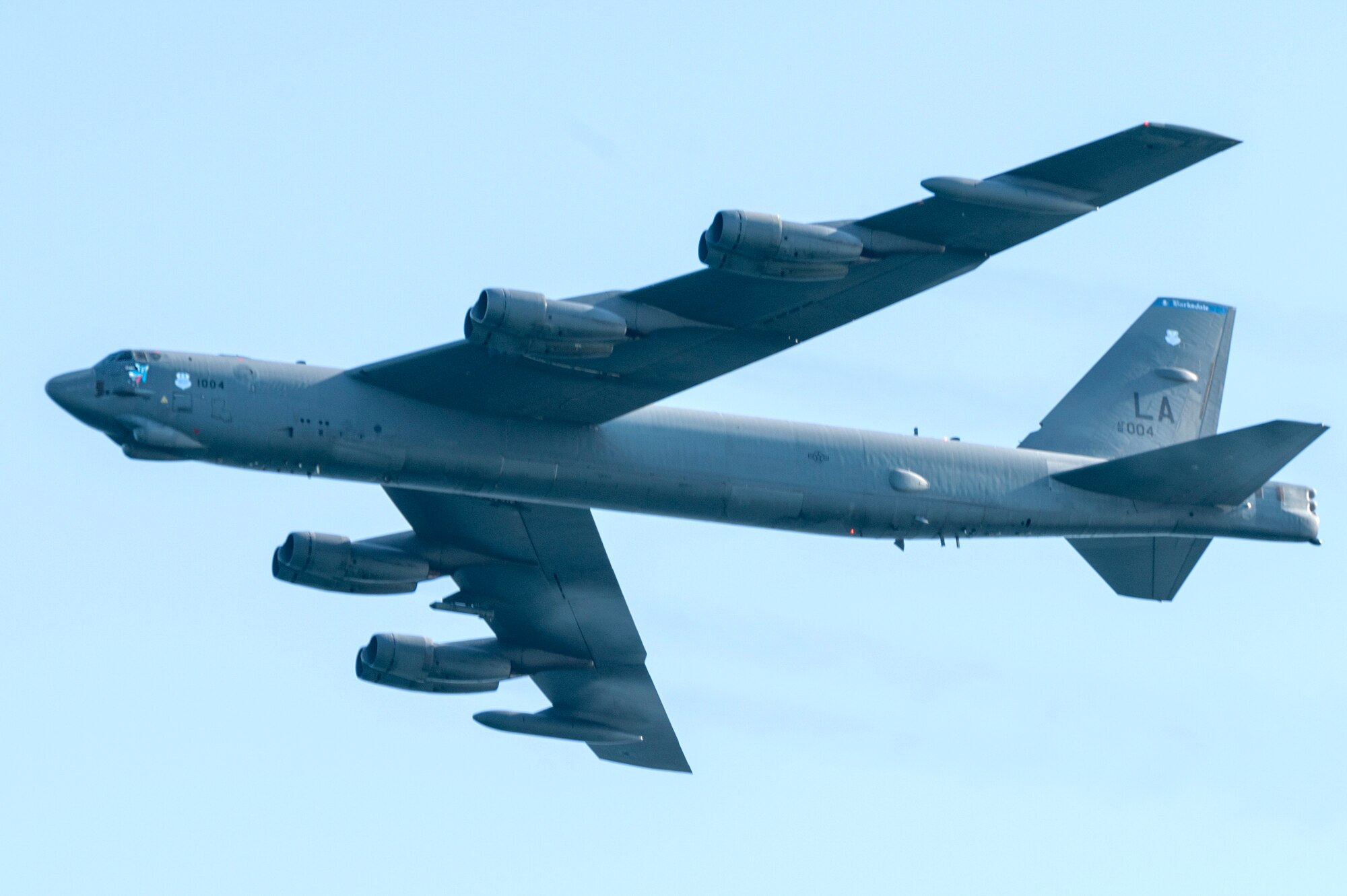 A B-52 Stratofortress assigned to the 2nd Bomb Wing, Barksdale AFB, LA, flies over during The Doolittle Raiders’ 80th Anniversary ceremony, April 18, 2022 at Okaloosa Island. On May 23, 2014, President Barack Obama signed Public Law 113-106 awarding the Congressional Gold Medal – the highest civilian recognition Congress can bestow – to the 80 members of the Doolittle Tokyo Raid in recognition of their service.