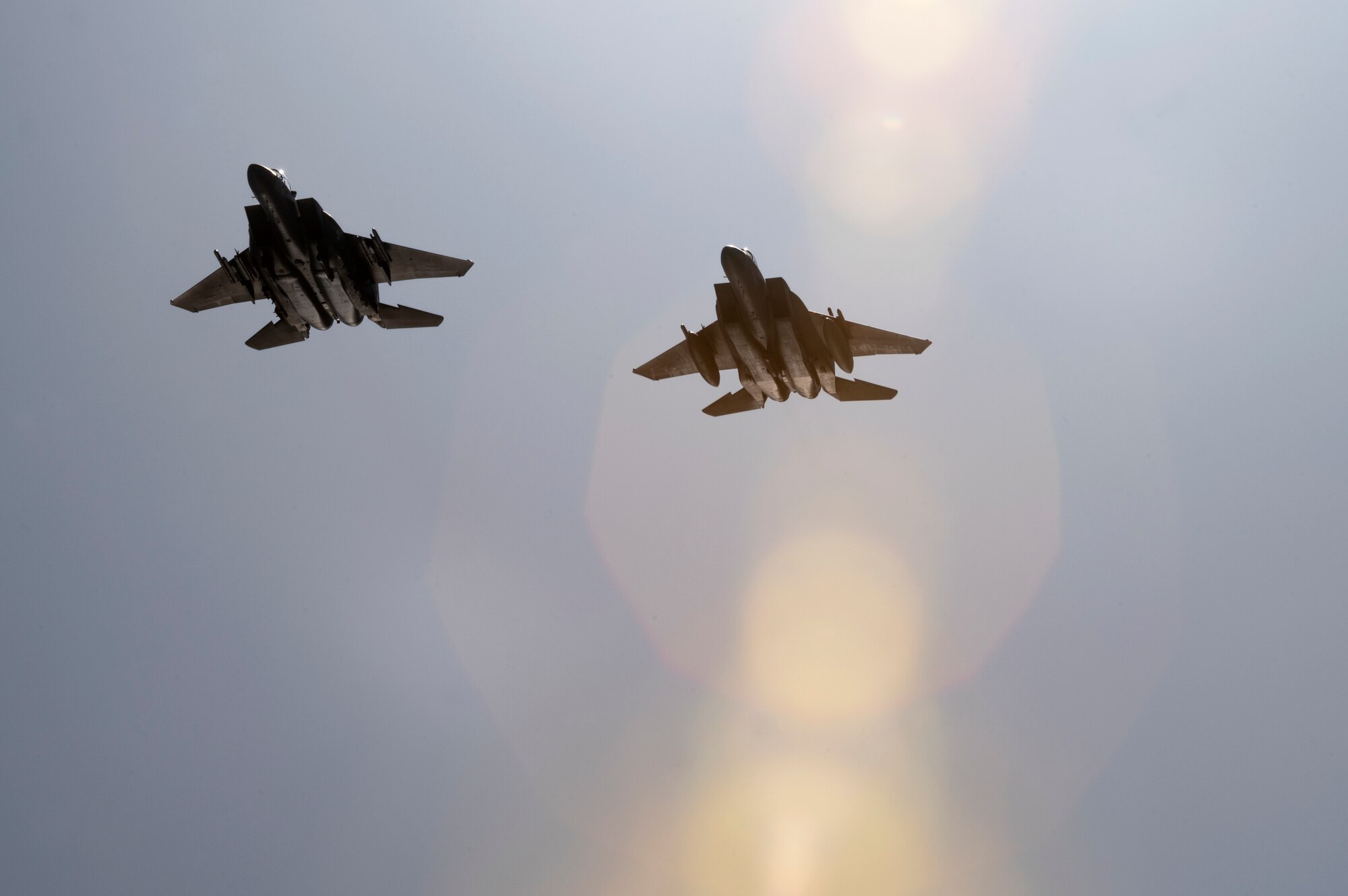 Two F-15E Strike Eagles, assigned to 85th Test and Evaluation Squadron, Eglin AFB, Fla., fly over  during The Doolittle Raiders’ 80th Anniversary ceremony, April 18, 2022 at Okaloosa Island. More than 14 aircraft including the B-25 medium bombers, which participated in the Doolittle Raid, conducted an aerial review over Okaloosa Island, Florida following a formal ceremony honoring participants of the air operation.