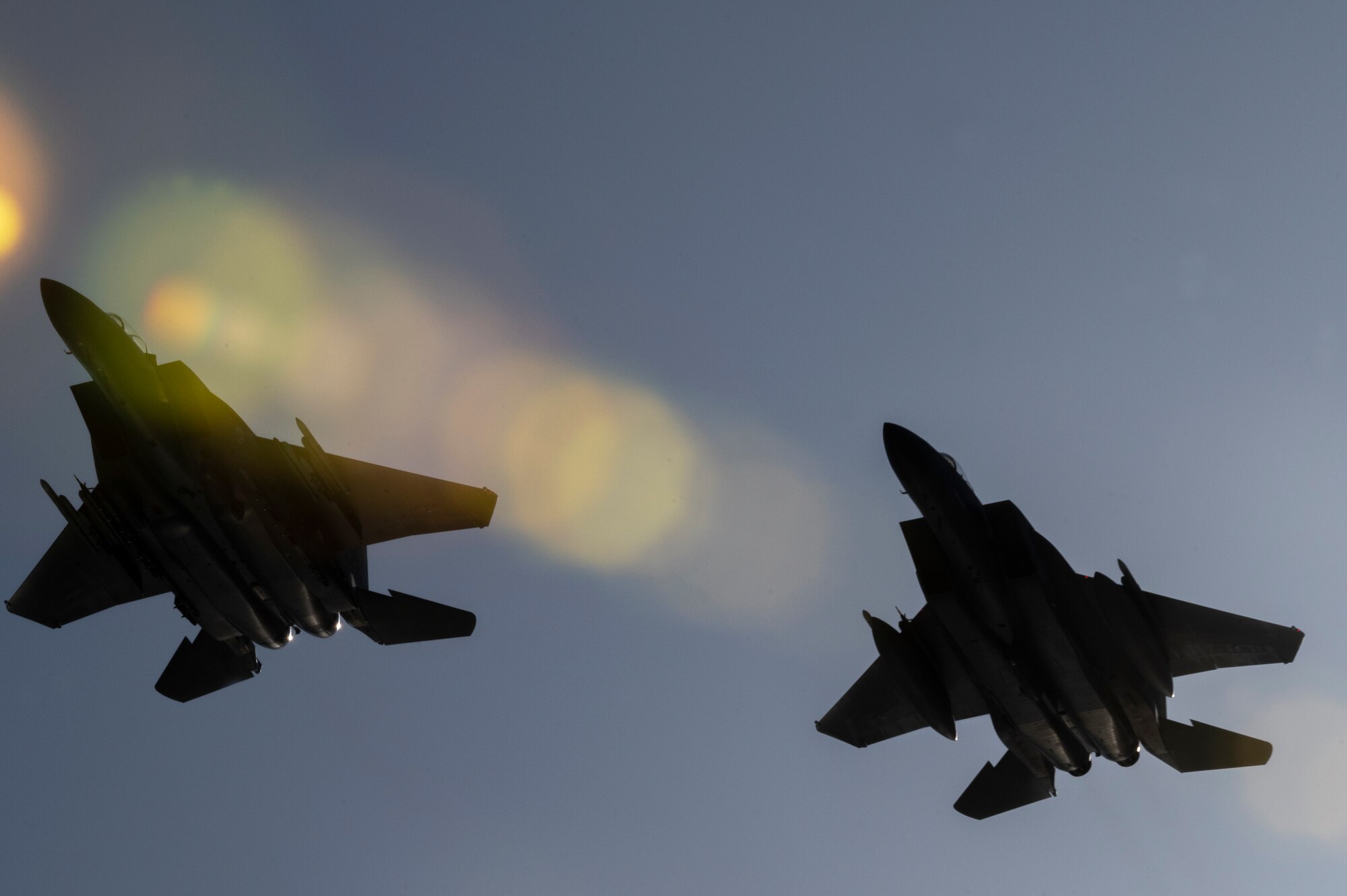 Two F-15E Strike Eagles, assigned to 85th Test and Evaluation Squadron, Eglin AFB, Fla., fly over  during The Doolittle Raiders’ 80th Anniversary ceremony, April 18, 2022 at Okaloosa Island. More than 14 aircraft including the B-25 medium bombers, which participated in the Doolittle Raid, conducted an aerial review over Okaloosa Island, Florida following a formal ceremony honoring participants of the air operation.