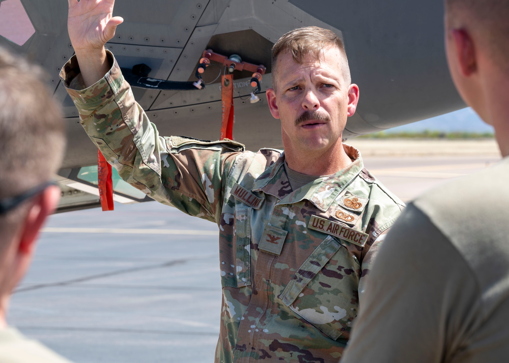 U.S. Air Force Col. Anthony J. “Rev” Mullinax, 56th Mission Support Group Commander, addresses Airmen participating in an Agile Combat Employment multi-capable exercise March 31, 2022, at Gila Bend Air Force Auxiliary Field, Gila Bend, Arizona.