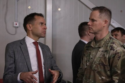 U.S. Army Brig. Gen. Keith Phillips, commander of the Office of Security Cooperation-Iraq (OSC-I), right, and Filip Vanden Bulcke, Belgium’s Ambassador to Iraq, hold a conversation at the Ambassadors Day conference at Union III forward operating base in Baghdad, Iraq, April 21, 2022. During the CJTF-OIR-hosted event, representatives from more than 25 Coalition countries discussed the CJTF-OIR mission and broad efforts to tackle enduring regional security and stability challenges. (U.S. Army photo by Spc. Nathan Smith)