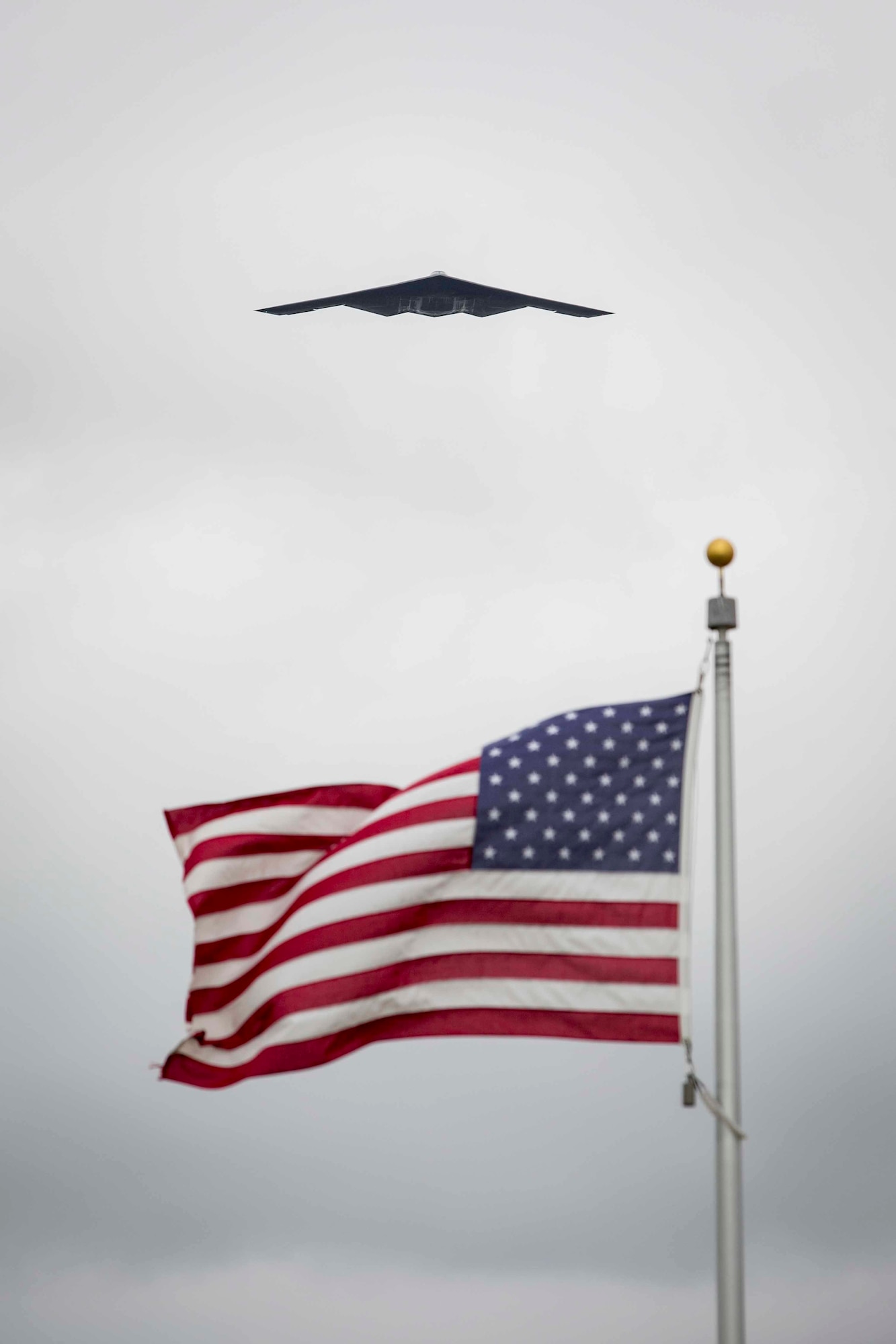A B-2 Spirit conducts a memorial flyover during a memorial service for Air Force Brig. Gen. Robert Cardenas at the Miramar National Cemetery, San Diego, California, March 31, 2022. Cardenas was born March 10, 1920, and passed away March 10, 2022. (U.S. Marine Corps photo by Lance Cpl. Jose S. GuerreroDeLeon)