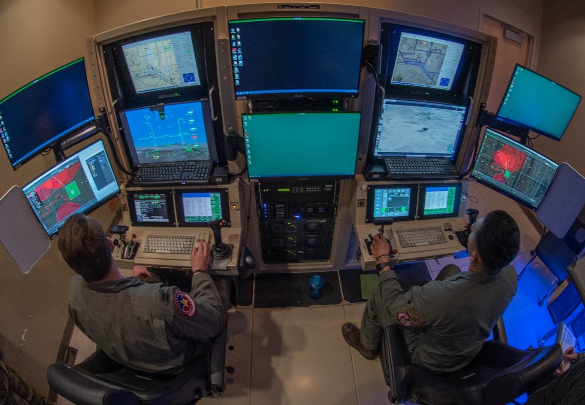 Pilot and sensor operator fly an MQ-9 simulator for Reaper Smoke.