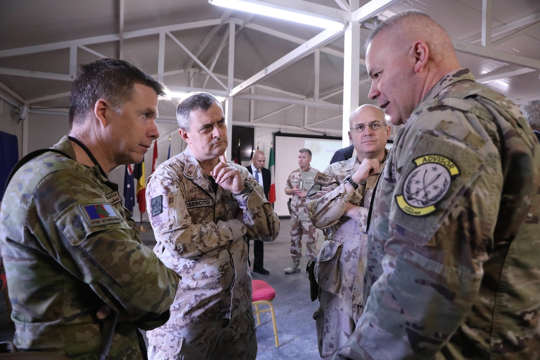 Brig. Gen. Nick Ducich, director of the Military Advisory Group – North, Combined Joint Task Force - Inherent Resolve (CJTF - OIR), right, addresses fellow attendees during the Ambassadors Day event at Union III forward operating base in Baghdad, Iraq, April 21, 2022. During the CJTF-OIR-hosted event, representatives from more than 25 Coalition countries discussed the CJTF-OIR mission and broad efforts to tackle enduring regional security and stability challenges. (U.S. Army photo by Staff Sgt. Bree-Ann Ramos-Clifton)