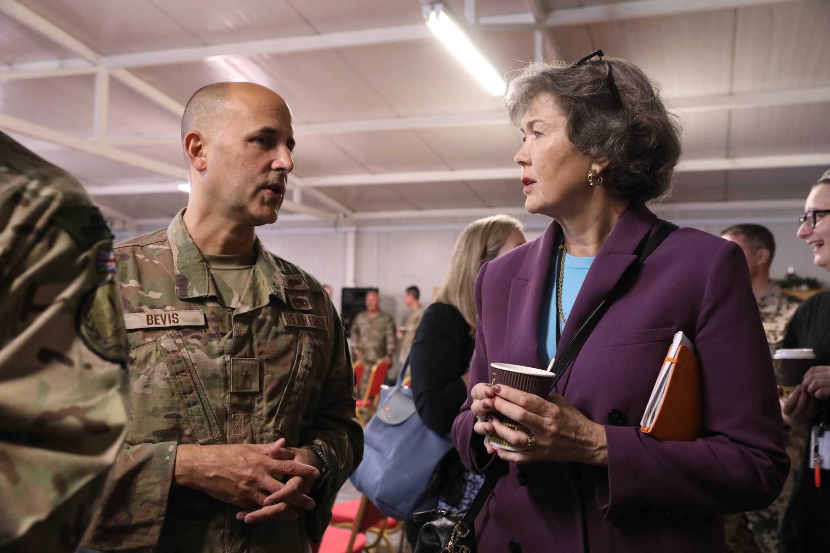 U.S. Air force Brig. Gen. Don Bevis, the senior commanding officer of North Atlantic Treaty Organization (NATO) – mission Iraq, left, and Laeticia van Asch, NATO Mission Iraq regional security officer, right, hold a discussion during the Ambassadors Day event at Union III forward operating base in Baghdad, Iraq, April 21, 2022. During the CJTF-OIR-hosted event, representatives from more than 25 Coalition countries discussed the CJTF-OIR mission and broad efforts to tackle enduring regional security and stability challenges. (U.S. Army photo by Staff Sgt. Bree-Ann Ramos-Clifton)