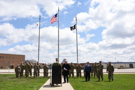 Maj Gen Richard Neely (TAG-Illinois) speaking from podium outside