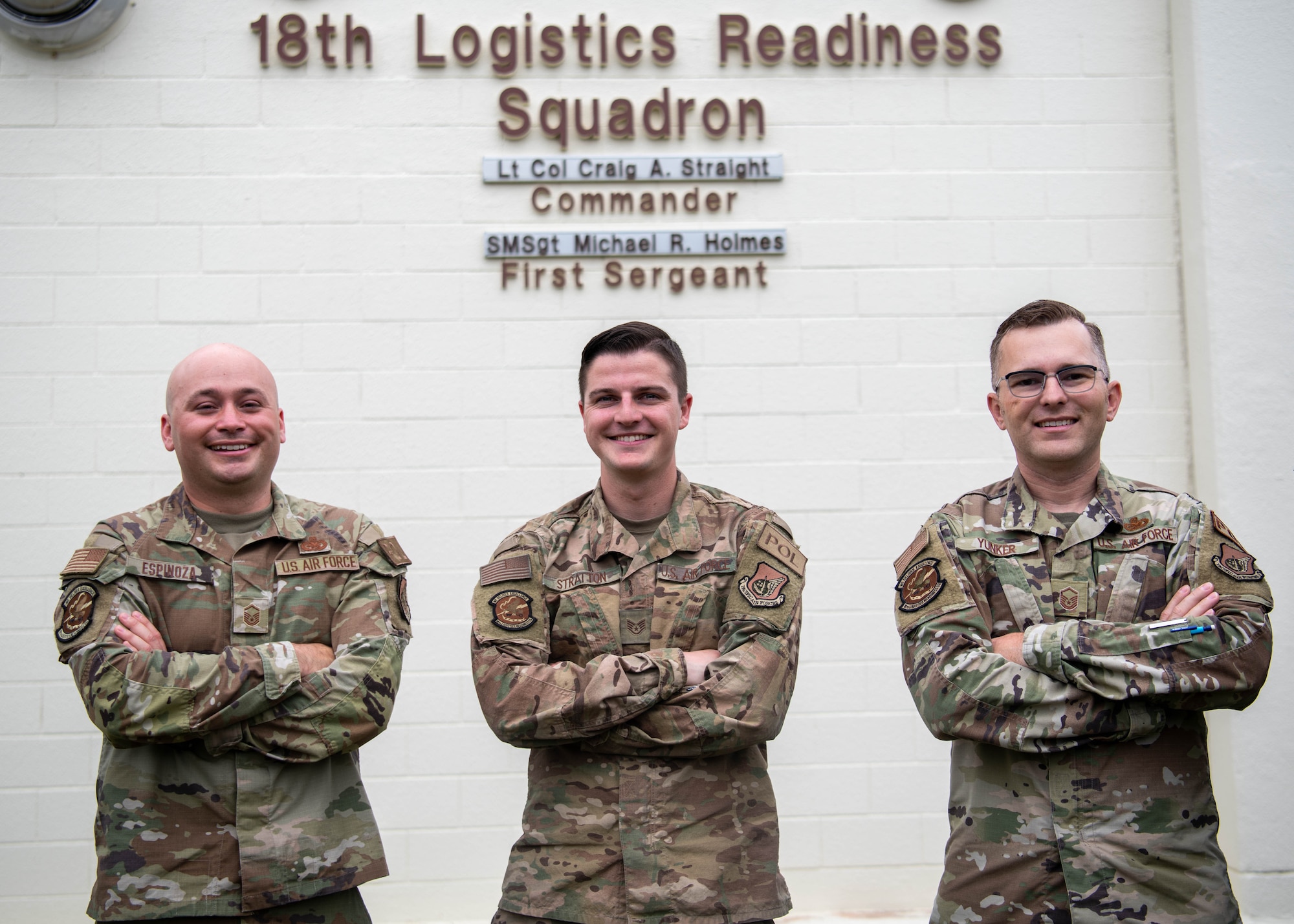 Three Airmen pose for a photo