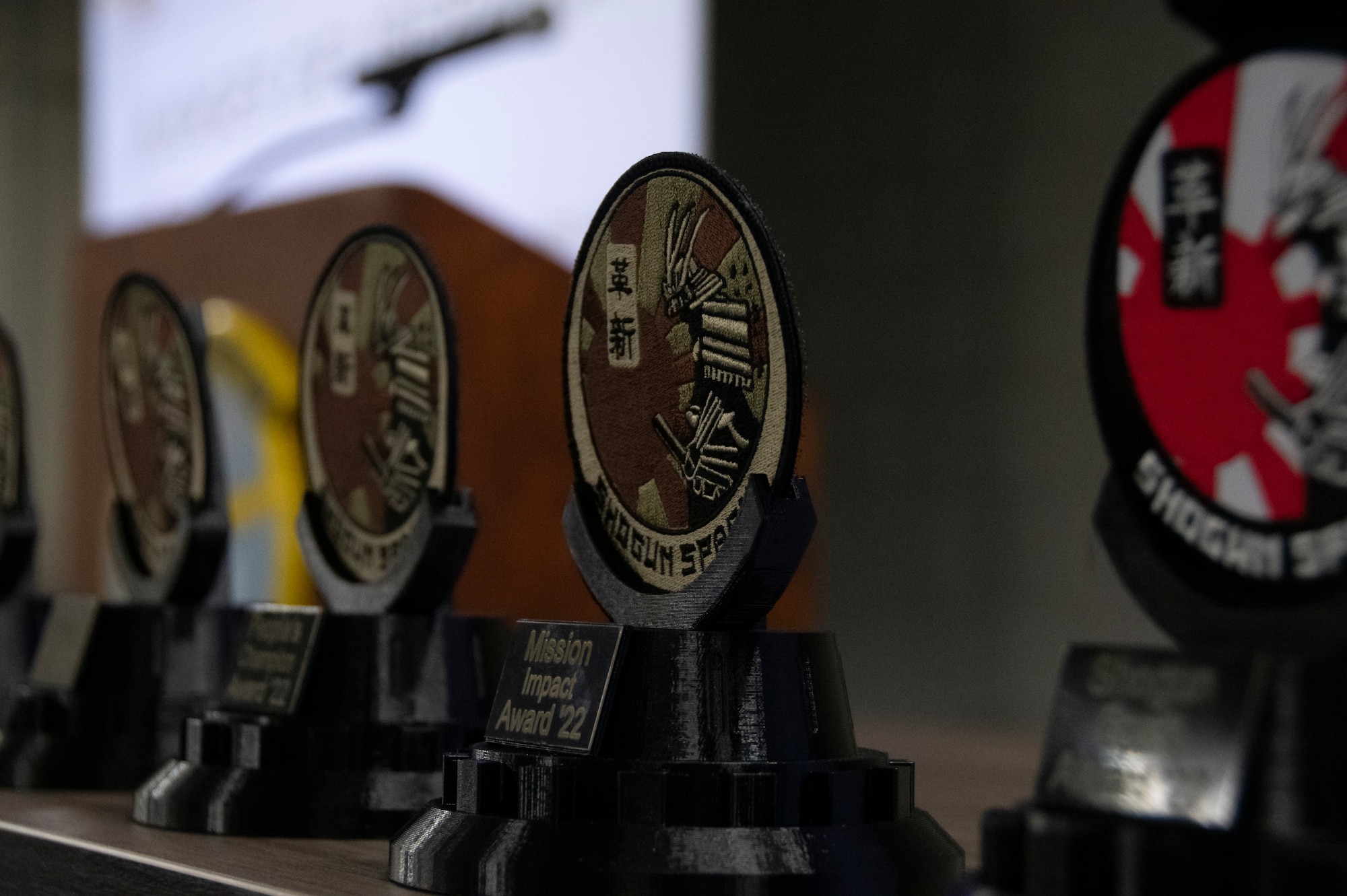 A row of trophies are displayed