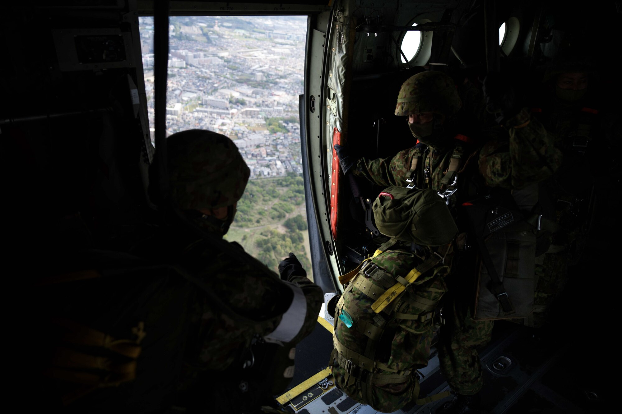 JGSDF members prepare to jump out of a C-130J.