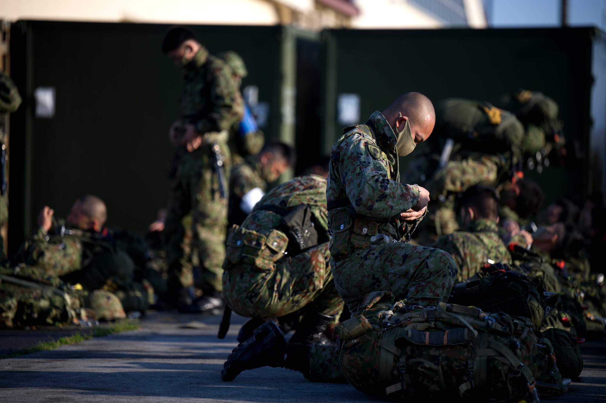 JGSDF members don static line jump equipment.