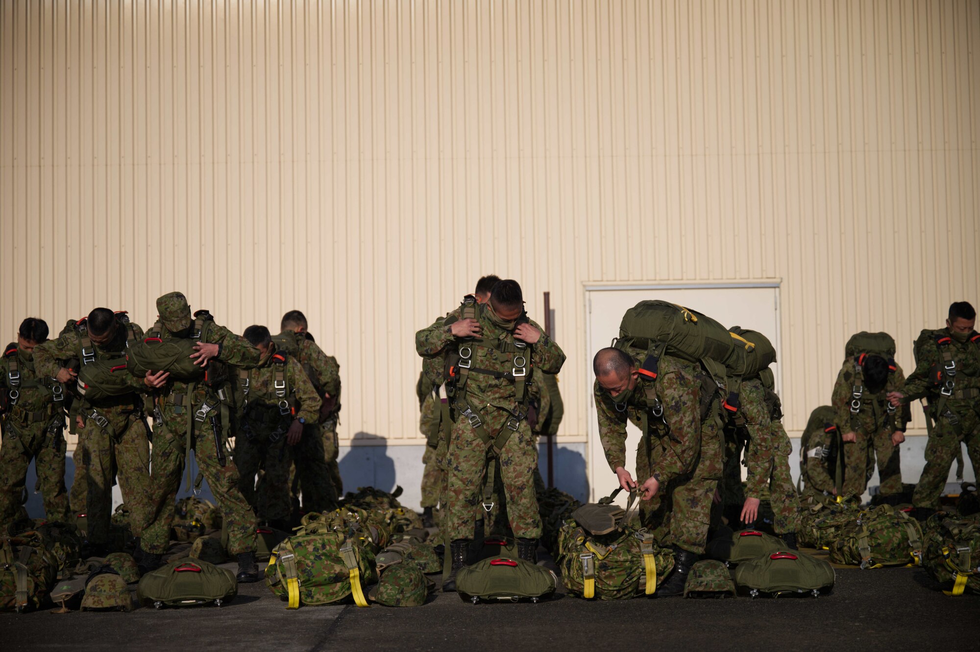JGSDF members don static line jump equipment.