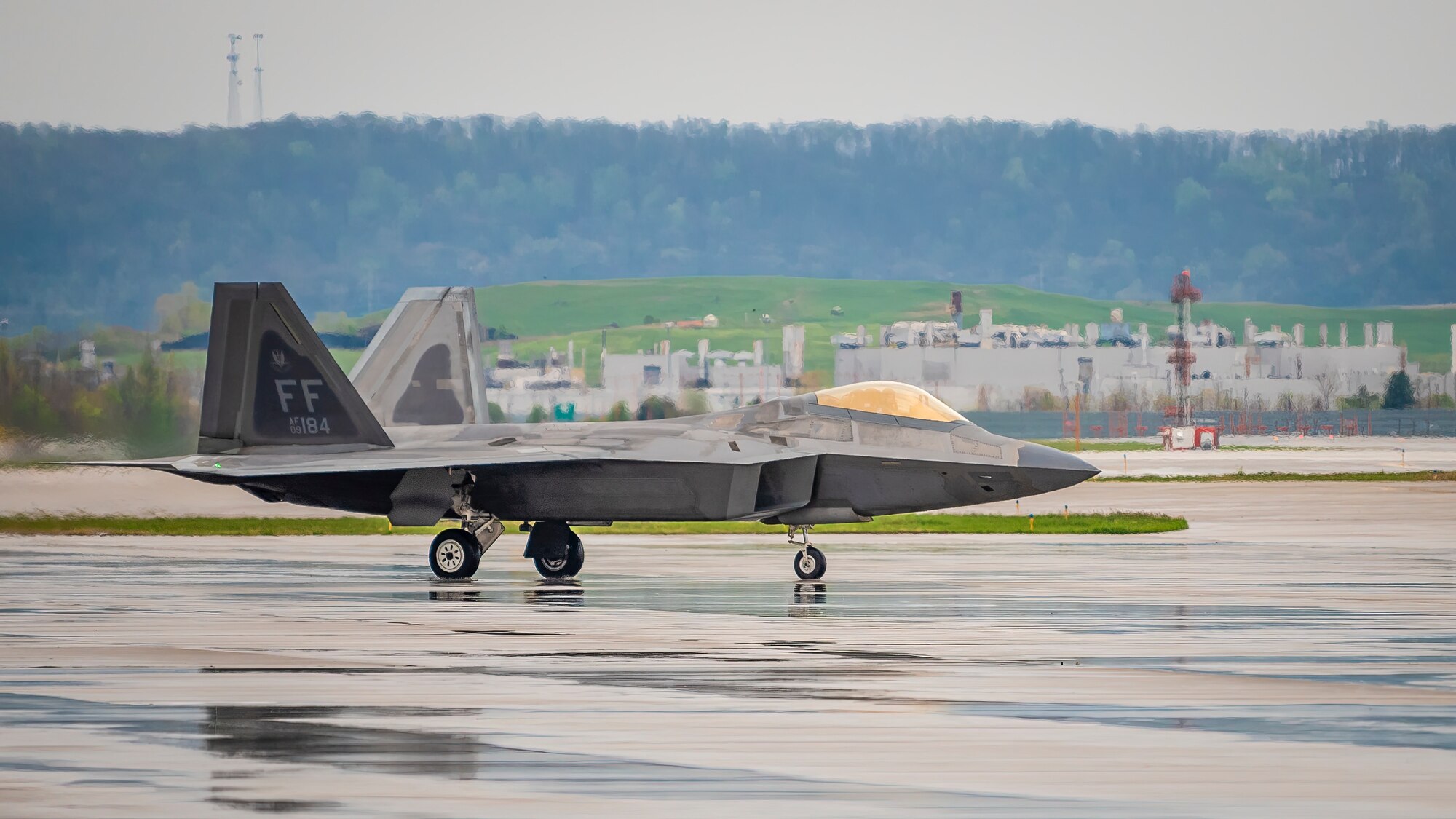 A U.S. Air Force pilot guides his F-22 Raptor to a parking spot on the flight line of the Kentucky Air National Guard Base in Louisville, Ky., April 21, 2022. The two-ship Raptor Demonstration Team will be among the highlights of this year’s Thunder Over Louisville air show, to be held on the banks of the Ohio River in downtown Louisville on April 23. The event, which celebrates the 75th anniversary of the United States Air Force, is slated to feature more than 30 military and civilian aircraft, including the B-2 Spirit, C-17 Globemaster III, CV-22 Osprey, CH-53 Sea Stallion, F-16 Viper and UH-60 Blackhawk, in addition to eight historic warbirds like the B-24 Liberator, B-29 Superfortress and P-51 Mustang. (U.S. Air National Guard photo by Dale Greer)