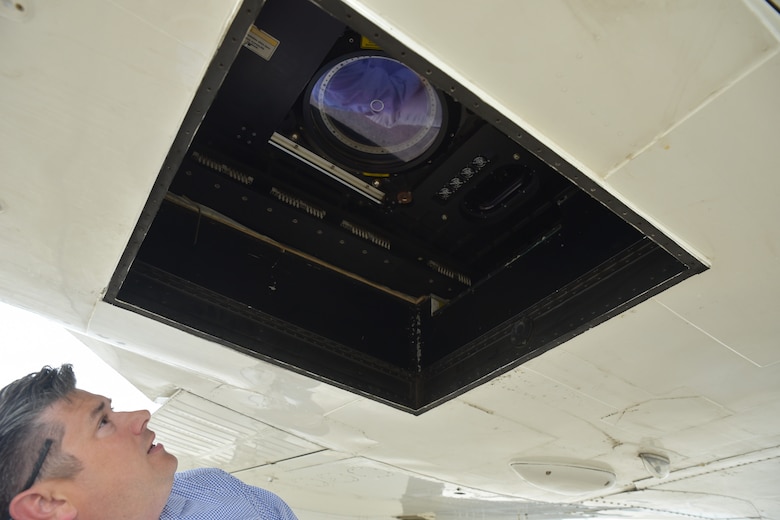 Chris Macon, Mobile District’s technical lead of the National Coastal Mapping Program, inspects the lidar lens prior to a calibration flight at Stennis International Airport, Mississippi April 18, 2022. The aircraft, which is a Beechcraft Super Air King 300, is equipped with two lidar sensors and two high resolution cameras that help gather the necessary data and imagery for the mapping program. The Joint Airborne Lidar Bathymetry Technical Center of Expertise team collects information about the waterways and coastline to ensure U.S. Army Corps of Engineers’ project success and completion. (USACE photo by Christopher Carranza)