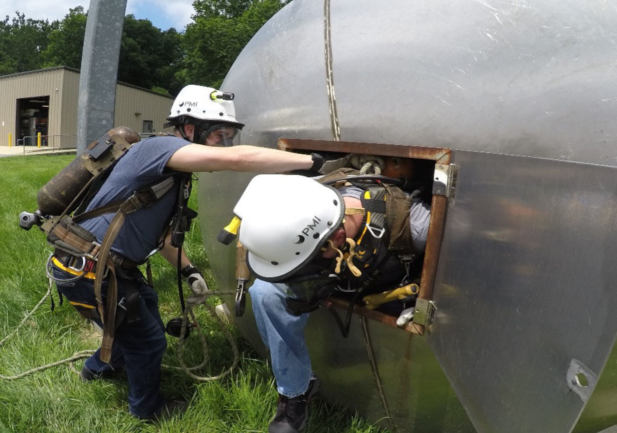 Addison Spicer, left, and Cameron Butcher, current and former members of the White Oak Rescue Team (WORT), respectively, conduct confined space training. The team was established in the late 1990s at Arnold Engineering Development Complex Hypervelocity Wind Tunnel 9 in White Oak, Maryland, to provide immediate lifesaving actions in the event of an emergency until county emergency responders arrive onsite. The WORT is trained to administer first aid, including CPR and automated external defibrillator, until the arrival of professional medical response personnel. (U.S. Air Force photo)