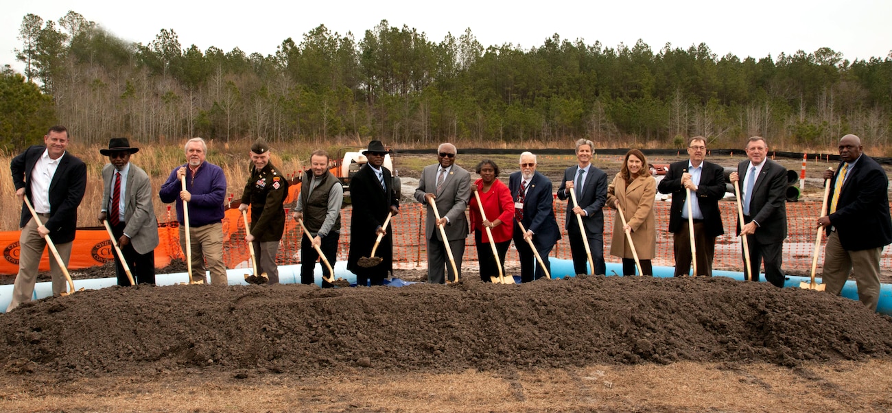 Agencies involved with the Winding Woods Reach and Elevated Water Tower pose for a photo at the groundbreaking.