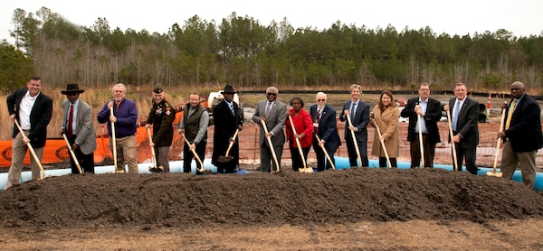 Agencies involved with the Winding Woods Reach and Elevated Water Tower pose for a photo at the groundbreaking.