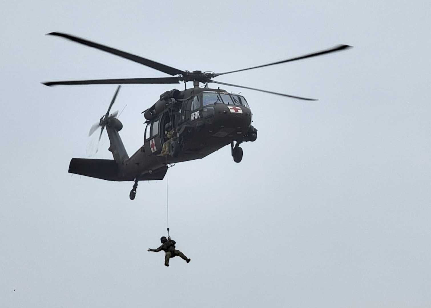 Virginia Army National Guard Soldiers with Detachment 2, Charlie Company, 1st Battalion, 169th Aviation Regiment, conduct high-performance rescue hoist training at Camp Bondsteel, Kosovo, March 28, 2022. Hoist operations are one of many capabilities the Black Hawk helicopter brings to the Kosovo Force mission.