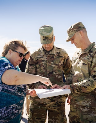 Lisa Metheney (left), Charleston District’s head civilian, and Lt. Col. Andrew Johannes (right), Charleston District commander, go over documents with Lt. Gen. Scott Spellmon, 55th chief of engineers and commanding general of the U.S. Army Corps of Engineers.