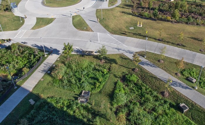 Panoramic view of the numerous microbioretentions on campus. The roadways and sidewalks are constructed out of "pervious" concrete, which allows stormwater to be absorbed through the surface, preventing runoff into the nearby Midway Branch of the Patuxent River.