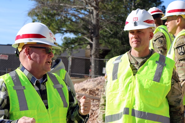 Bryan Tempio (left), a Resident Engineer with the U.S. Army Corps of Engineers Charleston District, discusses progress of a construction project at Fort Jackson to Command Sgt. Maj. Chad Blansett, command sergeant major for the U.S. Army Corps of Engineers South Atlantic Division.