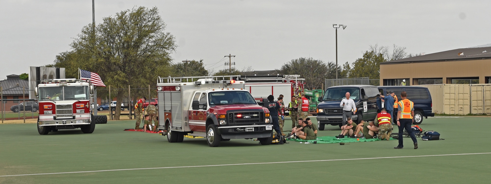 Medical members assigned to the 17th Training Wing establish a secure area to treat simulated victims during an active shooter exercise at Goodfellow Air Force Base, Texas, April 21, 2022. The exercise tested the emergency response capabilities from base medical professionals, law enforcement, and fire protection services. (U.S. Air Force photo by Senior Airman Abbey Rieves)
