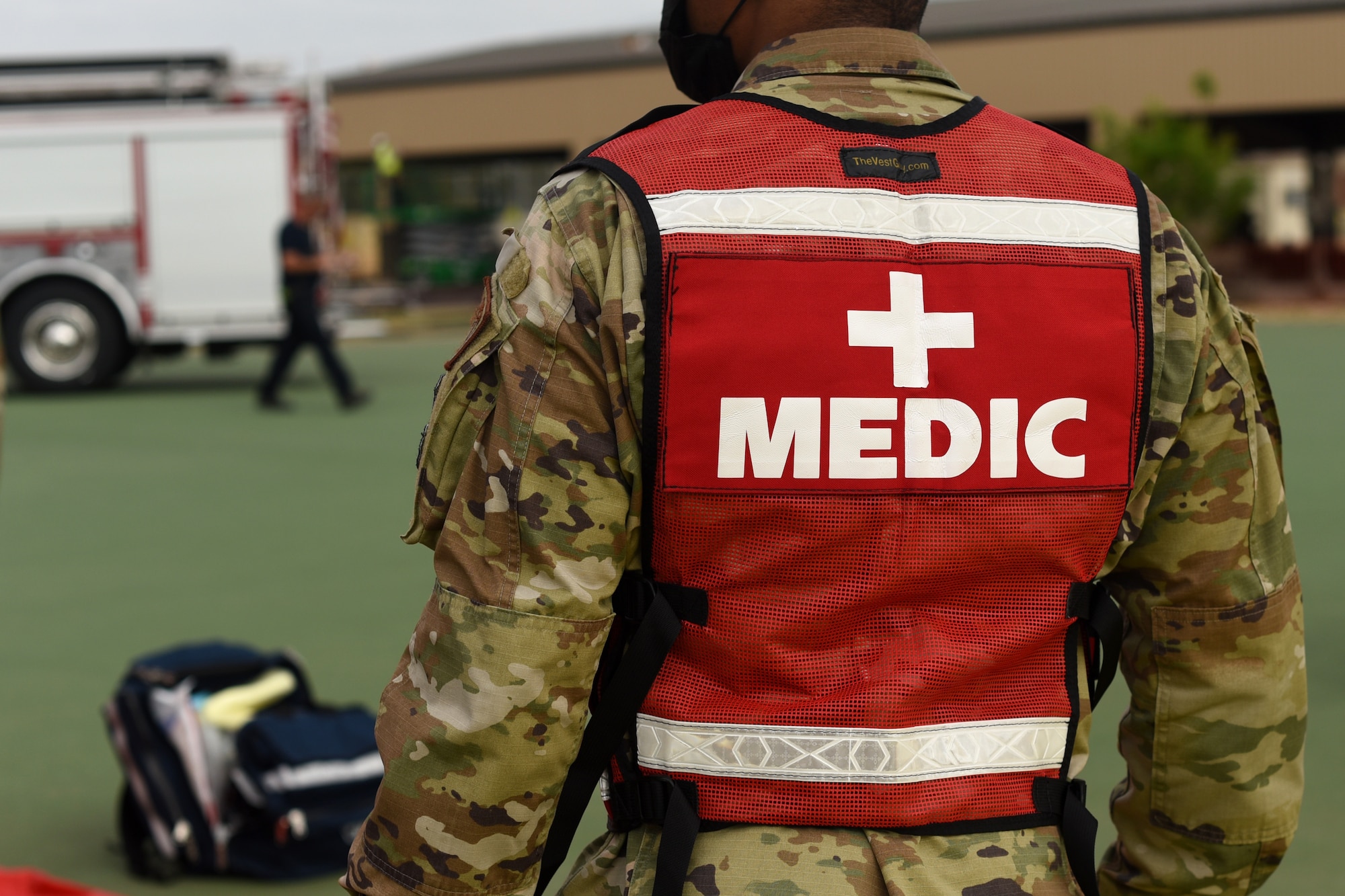 A service member assigned to the 17th Medical Group, surveys the make-shift triage center during an active shooter exercise at Goodfellow Air Force Base, Texas, April 21, 2022. Readiness exercises like this, strengthen military capabilities and augment working relationships between different emergency response agencies. (U.S. Air Force photo by Senior Airman Abbey Rieves)