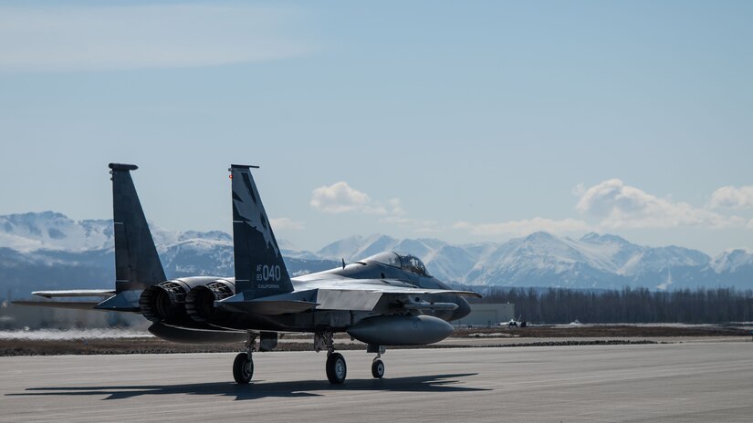 A photo of an F-15 Eagle sitting on the flight line.