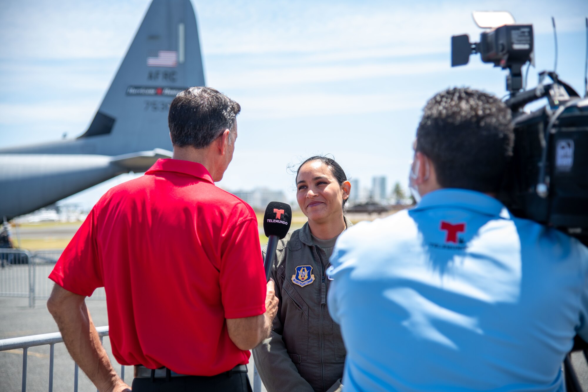 A cameraman records while a reporter interviews Lt. Cotto.