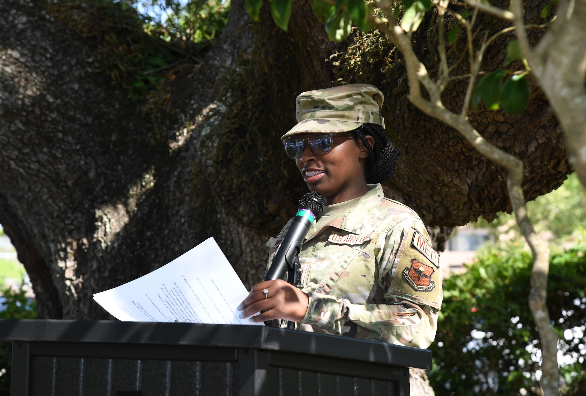 U.S. Air Force Senior Airman Arielle Williams, 81st Healthcare Operations Squadron medical technician, delivers remarks during the Earth Day Airman's Oak Plaque Presentation at Keesler Air Force Base, Mississippi, April 22, 2022. The plaque was unveiled during the event to celebrate Earth Day, with this year's theme being “Invest in Our Planet." (U.S. Air Force photo by Kemberly Groue)