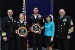 Washington, DC (April 22, 2022) -- Vice Admiral Bill Galinis, Commander, Naval Sea Systems Command (NAVSEA), Ms. Giao Phan, Executive Director, NAVSEA, and CMDCM(SW/AW) Justin Gray, Command Master Chief, NAVSEA, present the 2021 NAVSEA Sailor of the Year Award to FC1(SW/AW) Adriane Watson, Navy Region Mid-Atlantic (CNRMA) of SUBSHIP in Newport News, VA and Reservist EOD1 (EWS/EXW) William J. Eisenhart, Naval Surface Warfare Center, Expeditionary Medical Facility, Bethesda, MD, in a ceremony in the 2nd fl. Atrium of the Humphreys Building (Bldg. 197) at the Washington Navy Yard.