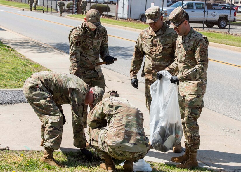 Airmen from the 316th Logistics Readiness Squadron participate in a base-wide trash clean up at Joint Base Andrews, Md., April 20, 2022. Units across the installation picked up trash during Earth Week to care for and protect the environment. (U.S. Air Force photo by Airman 1st Class Matthew-John Braman)
