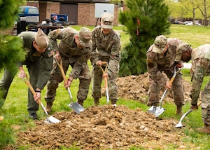Joint Base Andrews leadership participate in a tree planting ceremony near the base dormitories at Joint Base Andrews, Md., April 21, 2022. Joint Base Andrews has held a tree planting event for 37 consecutive years. (U.S. Air Force photo by Airman 1st Class Matthew-John Braman)