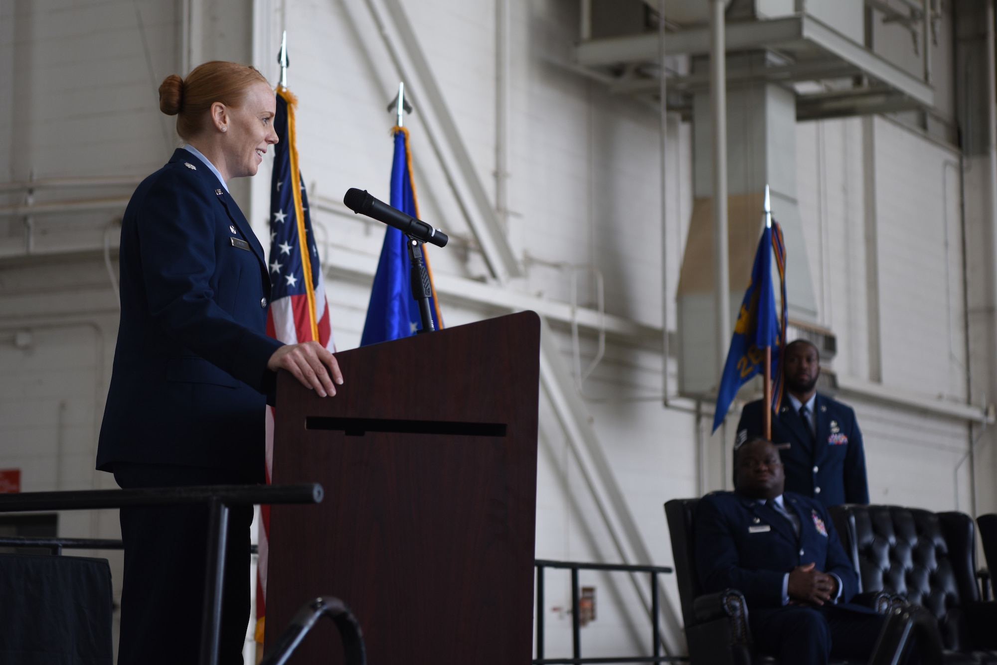 U.S. Air Force Lt. Col. Kristen Jenkins, 28th Bomb Squadron commander, delivers remarks after assuming command of the squadron during the 28th BS change of command ceremony inside the Three Bay Hangar at Dyess Air Force Base, Texas, April 22, 2022. Jenkins assumed command of the 28th BS which provides all B-1 initial qualification and instructor upgrade training. (U.S. Air Force photo by Staff Sgt. Holly Cook)