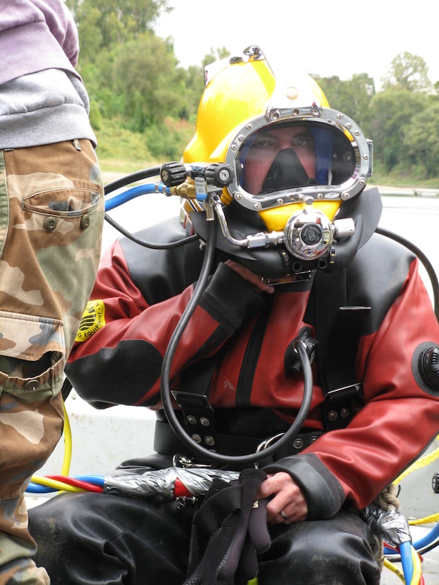 IN THE PHOTO, Biologist John “Mike” Thron diving with the district dive team, exploring rivers from the bottom up.