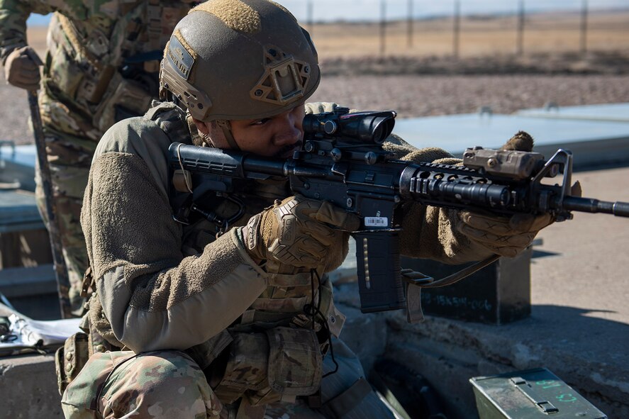 Airman Trent Griffin, 841st Missile Security Forces Squadron defender, guards a missile launch facility during a training exercise April 19, 2022, near Malmstrom Air Force Base, Mont. Griffin responded to simulated enemy combatants during the exercise at the launch facility. The exercise was designed to test teamwork, lethality and tactics of defenders during combat scenarios. (U.S. Air Force photo by Airman 1st Class Elijah Van Zandt)
