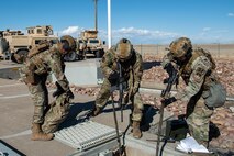 Three members from the 341st Missile Security Operations Squadron tactical response force secure a launch facility during a training exercise April 19, 2022, near Malmstrom Air Force Base, Mont. TRF’s role in the exercise was to provide support to 841st Missile Security Forces Squadron defenders already on site. The exercise was designed to test all personnel’s teamwork and knowledge of policy and procedures. (U.S. Air Force photo by Airman 1st Class Elijah Van Zandt)