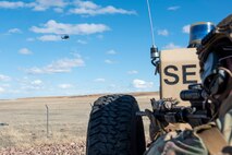 A 341st Missile Security Operations Squadron tactical response force member, scans the fence line of a launch facility during a training exercise April 19, 2022, near Malmstrom Air Force Base, Mont. The exercise tested personnel’s combat abilities against simulated enemy combatants. The 40th Helicopter Squadron also provided air support through radio communication and simulated air support. (U.S. Air Force photo by Airman 1st Class Elijah Van Zandt)
