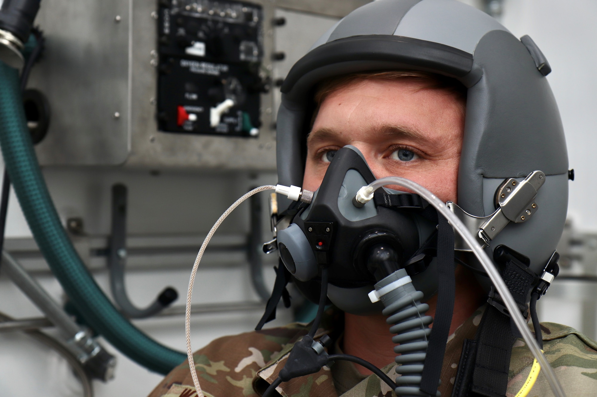 Tech. Sgt. Tyler Wineman waits for an oxygen system test to begin inside a Research Altitude Chamber at Wright Patterson Air Force Base, Ohio, April 15, 2022. The chamber is one of three at the base that were certified in March for manned research up to 50,000 feet, a benchmark found nowhere else in the Department of Defense. Wineman is an aircrew flight equipment research technician assigned to the 711th Human Performance Wing, the Air Force Research Laboratory unit that operates the chambers. (U.S. Air Force photo/Jason Schaap)