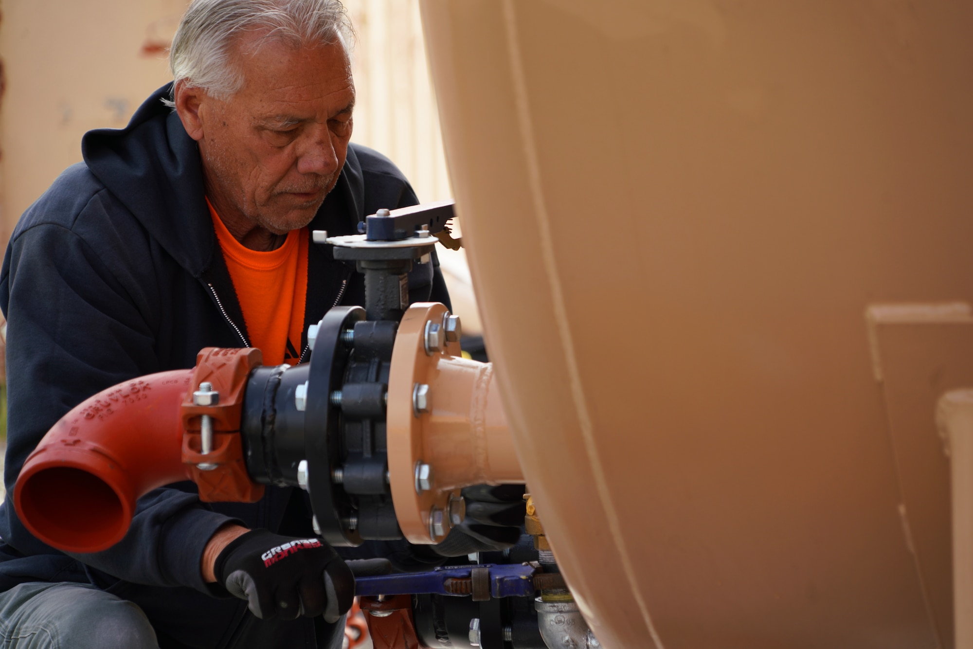 Tom Miszklevitz, a Manager with Perimeter Solutions, installs an upgraded fire retardant ground tank system for the 146th Airlift Wing's new MAFFS (Modular Airborne Fire Fighting System) pit at the Channel Islands Air National Guard Station, Port Hueneme, California. March 2, 2022. The new fire-retardant ground tanks have increased the storage capability five-fold from a 10,000-gallon capacity to 50,000 gallons to accommodate more MAFFS aircraft and the U.S. Forest Service's Very Large Air Tankers (VLAT's) with water and fire retardant solution. (U.S. Air National Guard photo by Staff Sgt. Michelle Ulber)