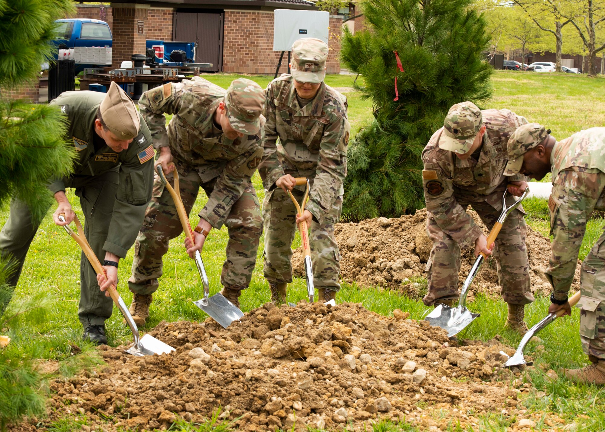 Joint Base Andrews leadership participate in a tree planting ceremony near the base dormitories at Joint Base Andrews, Md., April 21, 2022. Joint Base Andrews has held a tree planting event for 37 consecutive years. (U.S. Air Force photo by Airman 1st Class Matthew-John Braman)