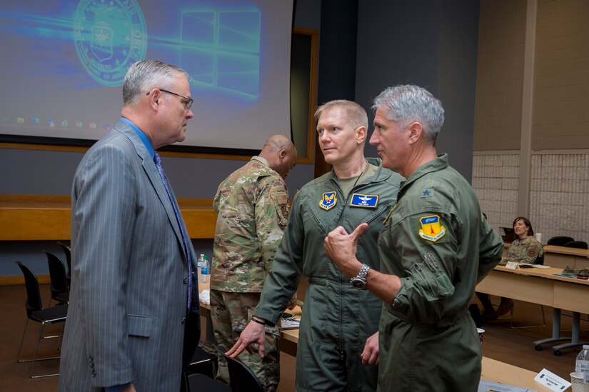 Randall Robinson, left, executive deputy to the commanding general of the Army Installation Management Command, talks with Col. Paul Birch and Brig. Gen. Jeremy T. Sloane, the incoming and outgoing commanders of Joint Base Marianas, Guam, at the Air Force Installation and Mission Support Center’s Joint Base Commanders Summit at Joint Base San Antonio-Lackland, Texas, April 20, 2022. The summit included discussions between joint base leaders, Office of the Secretary of Defense, Army Installation Management Command and AFIMSC leadership regarding unique installation and mission support issues at their bases. (U.S. Air Force photo by Malcolm McClendon).