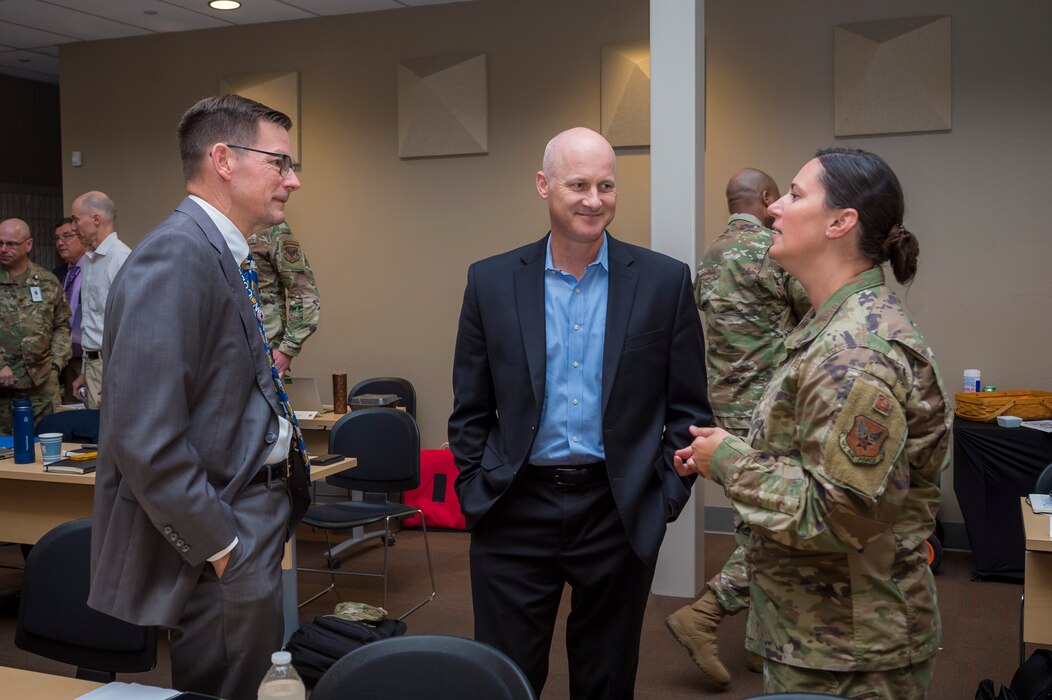 Sam Grable, center, director of the Air Force Installation and Mission Support Center’s Installation Support Directorate, Steve Shea, chief of AFIMSC’s Installation Support Directorate Mission Activity Integration Division, and Col. Tammie Harris, director of Joint Basing for the Office of the Secretary of Defense, meet at the AFIMSC Joint Base Commanders Summit at Joint Base San Antonio-Lackland, Texas, April 20, 2022 The summit included discussions between joint base leaders, Office of the Secretary of Defense, Army Installation Management Command and AFIMSC leadership regarding unique installation and mission support issues at their bases. (U.S. Air Force photo by Malcolm McClendon).