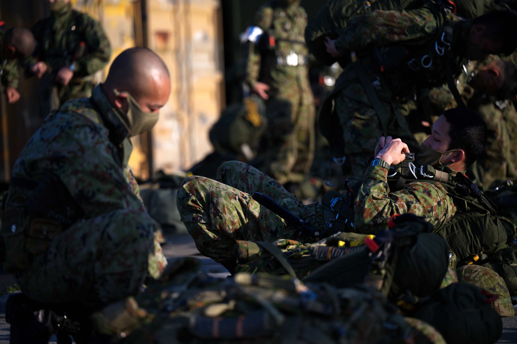 JGSDF members don static line jump equipment.