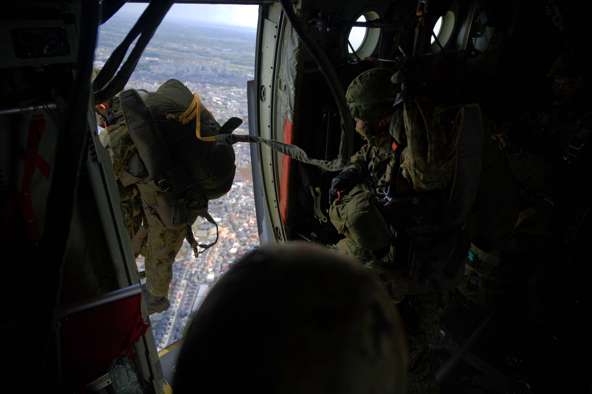 JGSDF members jump out of a C-130J.