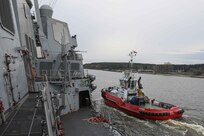 Lithuanian tugboat TAK-10, right, sails beside Arleigh Burke-class guided-missile destroyer USS Gravely (DDG 107), while Gravely arrives at Klaipeda, Lithuania, for a scheduled port visit, April 24, 2022.
