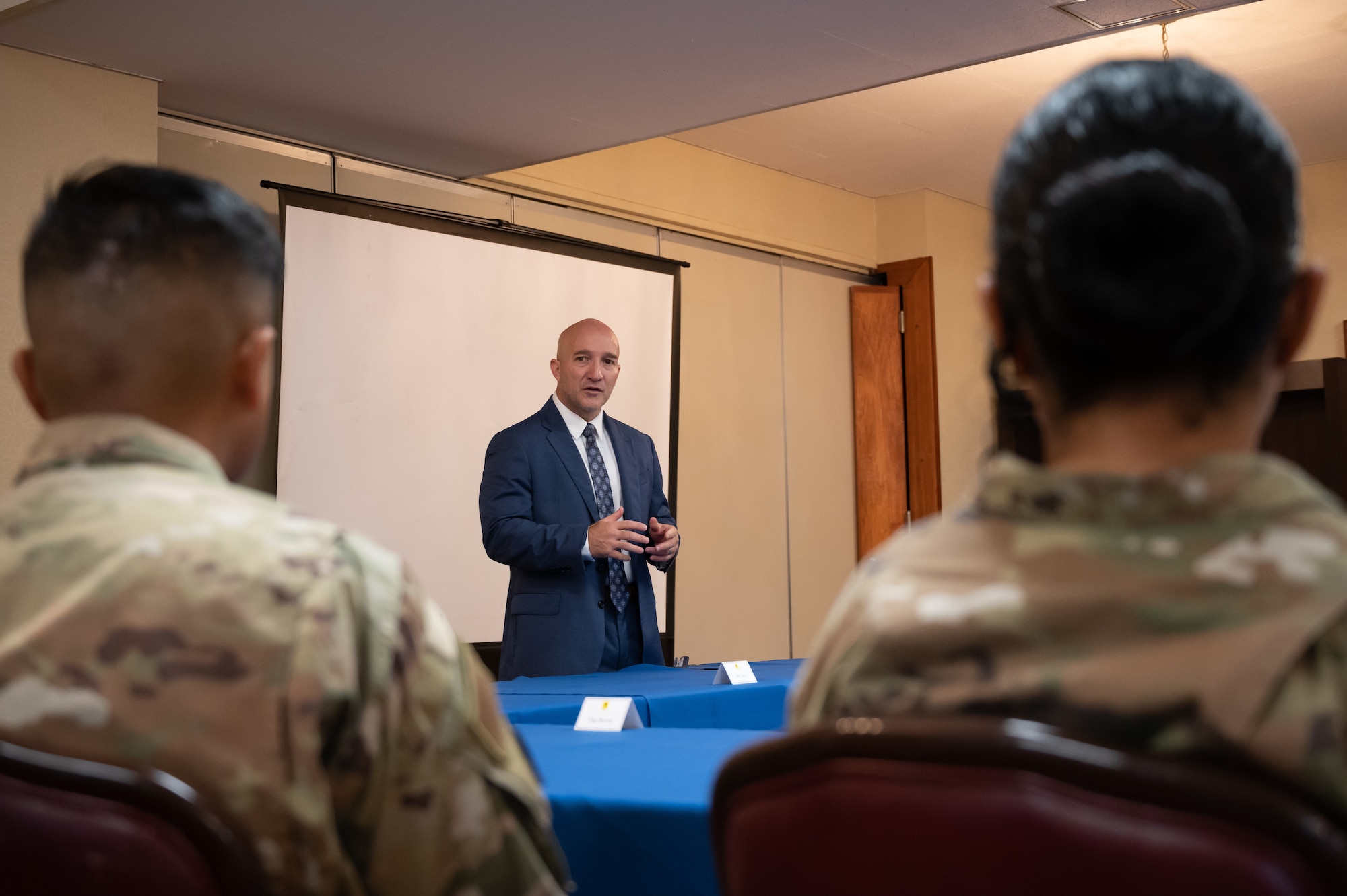 man speaking to Airmen